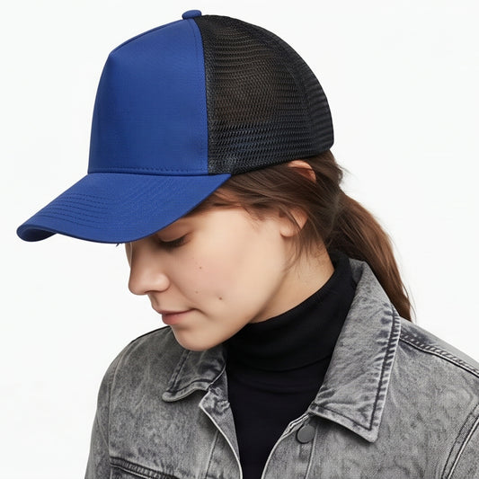 Person wearing a blue and black trucker cap on a white background