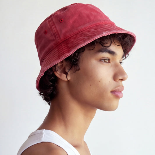 Person wearing a red bucket hat on a white background